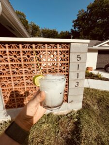 Decorative brick privacy wall with stone address pillar